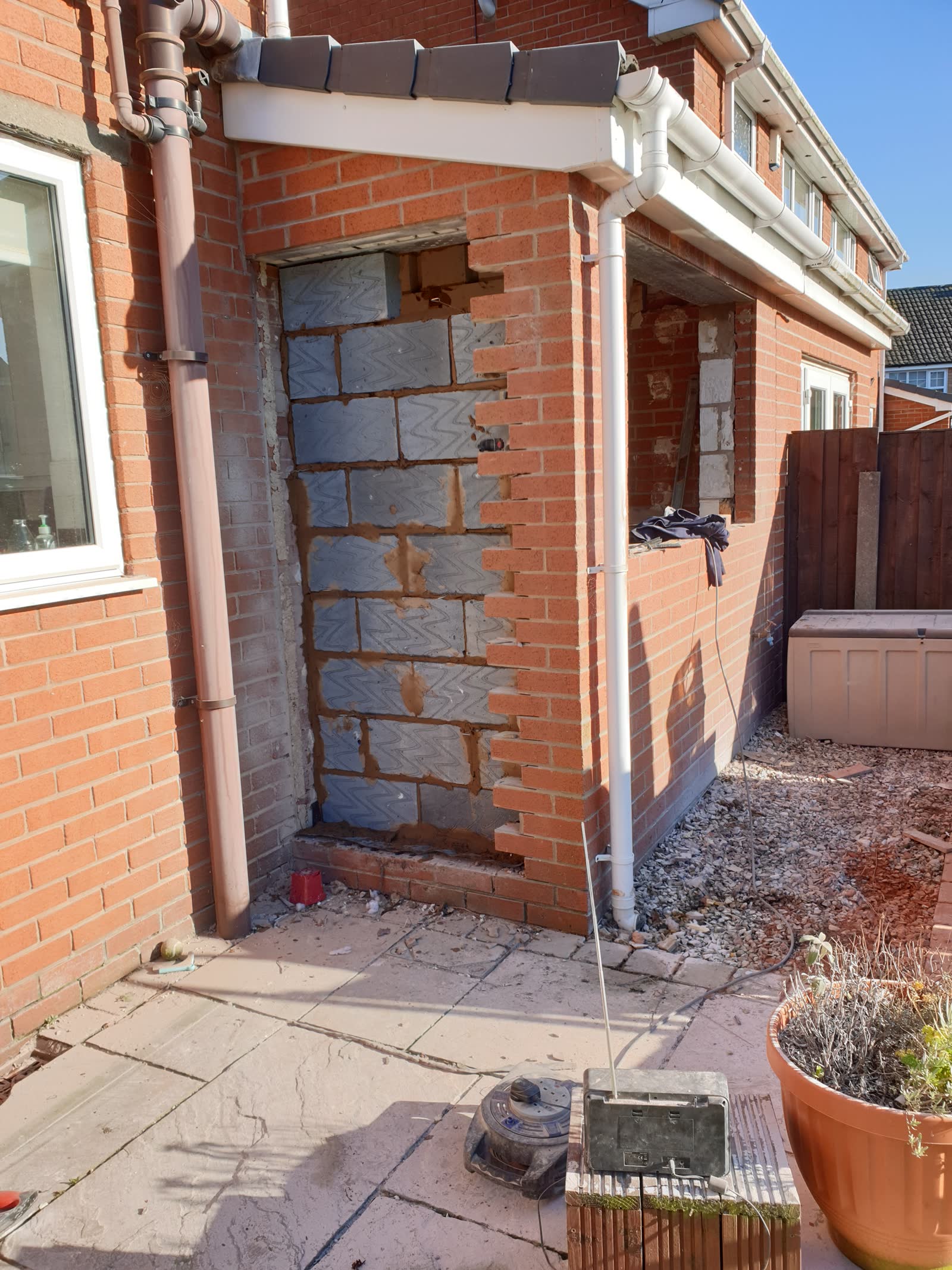 Brick opening with toothing into existing wall and inner breeze-block leaf